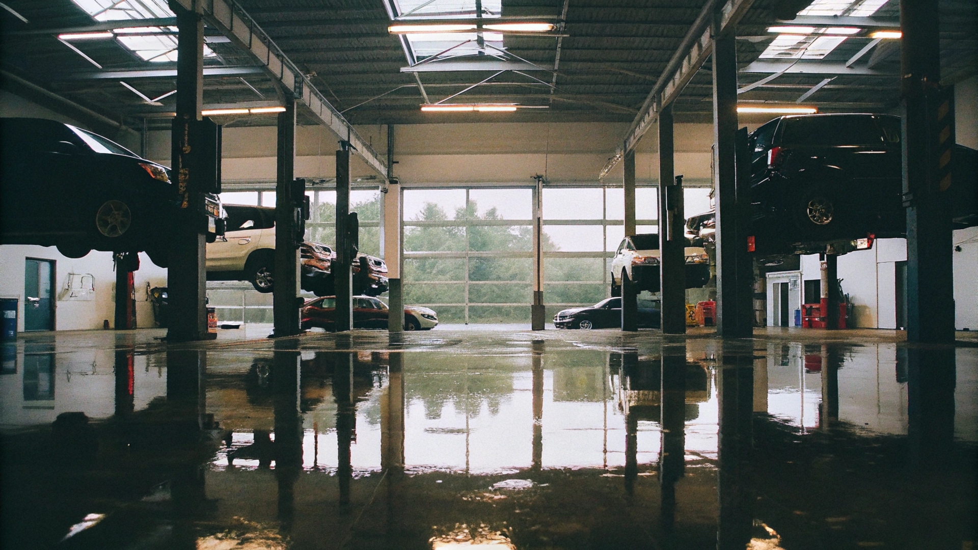 Modern auto garage interior with professional lifts and diagnostic equipment